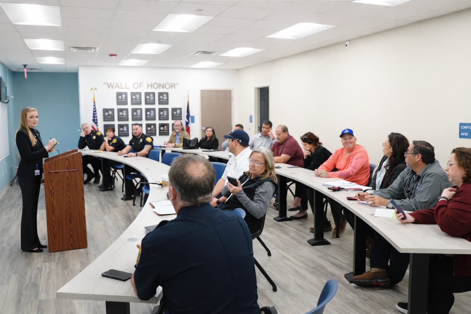 Kaylynn Paxson speaking with community members at a local meeting